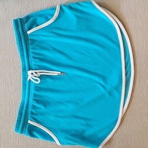 Turquise TERRYCLOTH mini skirt with white trim.  Ties at waist.  Size is 19 XXL